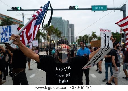 Miami, Fl, Usa - June 7, 2020: Love Trumps Hate T-shirts. White Man Masked By Coronavirus Pandemic W