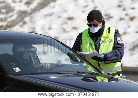 Sofia, Bulgaria - 3 April, 2020: A Police Officer Checks A Car Drriver At One Of The Exits Of Sofia,