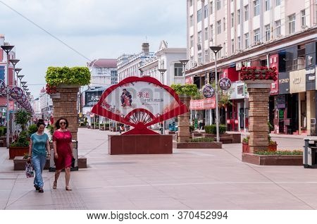 China, Heihe, July 2019: A Large Fan On The Central Shopping Pedestrian Street During The Day In Hei