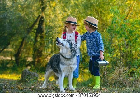 Kids Love Story. Happy Little Couple Kids And Dog Together As Friends As Love Of Animals Concept. Ha