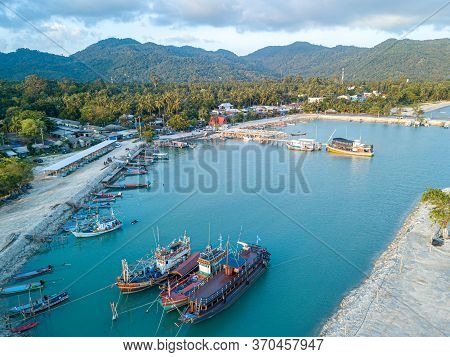 Aerial View Of Baan Tai Pier Or Huatean Pier At Phangan Island With Clear Blue Sky, Thailand