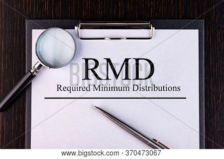 Paper With Required Minimum Distributions Rmd On A Table
