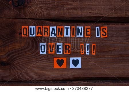 Quarantine Is Over Paper Letters Sign On Wooden Background. Opening Borders Between Countries. End O