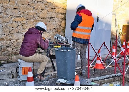 Limoux Aude France 12/10/19 Technicians Working In The Street Installing Fibre Optic Network For Hig