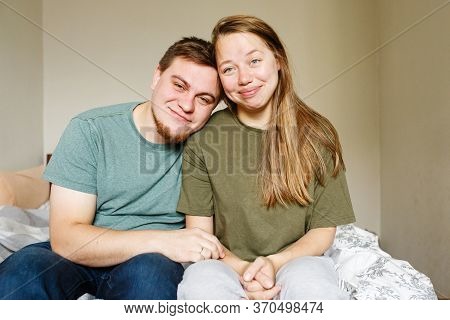 Tired Beautiful Married Couple In Casual Clothes Sitting At Home Together During Lockdawn