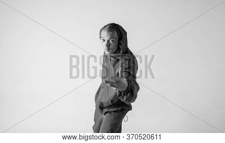 A Man Hip Hop Dancer Or Bboy Freezes In One Pose On A White Background. Bboy Doing Stylish Stunts.