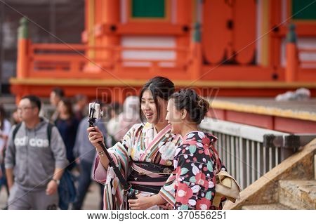 Japanese Girls Dressed In Kimonos At Kiyomizu-dera Temple In Kyoto, Japan