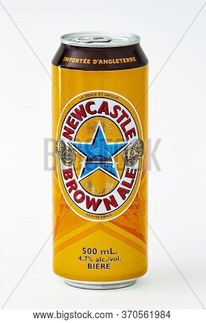 Calgary, Alberta, Canada. June 08, 2020. An Isolated Newcastle Brown Ale Tallboy Beer Can On A White