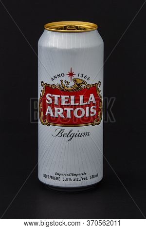 Calgary, Alberta, Canada. June 08, 2020. An Isolated Stella Artois Tallboy Beer Can On A Black Backg