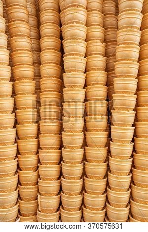 Ice cream cones background. Waffle cones for dondurma ice-cream close-up. Many tasty ice cream cones in icecream shop