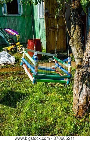 Old Child Teeterboard On An Apple Tree