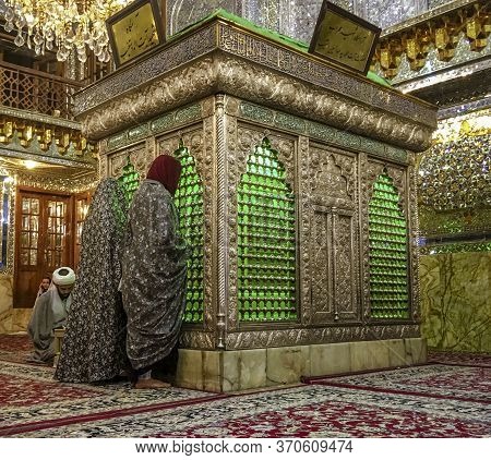 Shiraz, Iran - 2019-04-09 - Shah Ceragh Shrine - Men Pray At Mirrored Tomb Of Mullah.