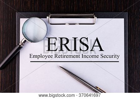 Paper With Employee Retirement Income Security Act Erisa On A Table