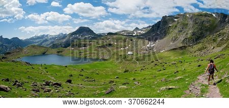 An Hiker Woman On The Path Near Ayous Lake In The French Pyrenees Mountains