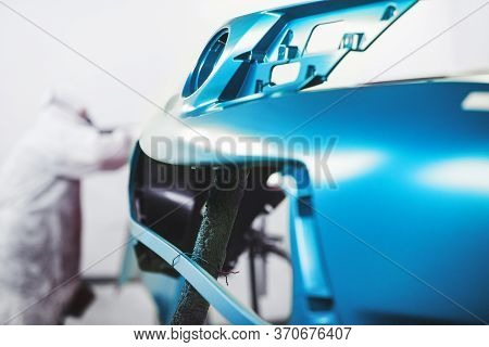 Car Body Element Being Painted In Paint Booth. Auto Body Repair.