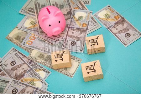 Pink Piggy Bank, Three Delievery Box And Dollar Banknotes On Blue Bakground. Online Shopping And Del