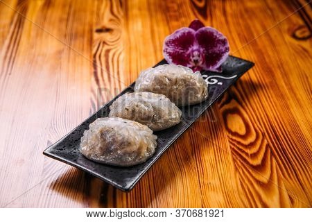 Side View On Korean Patties Starchy Pyan-se Pygody On The Wooden Table, Horizontal
