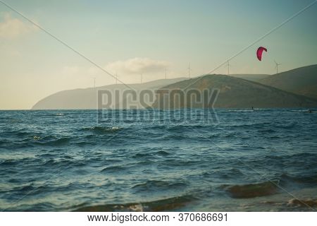 Kitesurfer Riding On The Waves At Prasonisi Kite Beach At Rhodes Island In Summer Day