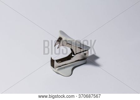 An White Anti-stapler On A White Background