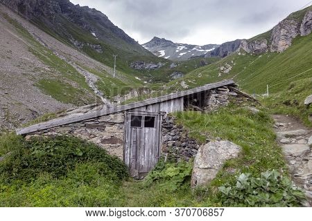An Old Shepherd Shelter With A View Of Grossglockner. Hiking Travel Outdoor Concept, Journey In The 