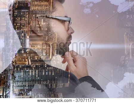 Double Exposure Of Young Businessman And Night Cityscape. Financial Analytics