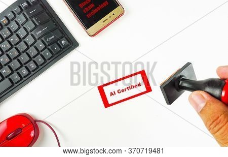 Conceptual Image Of Artificial Intelligence. Top View Of Fingers Holding Rubber Stamp Ai Certified O
