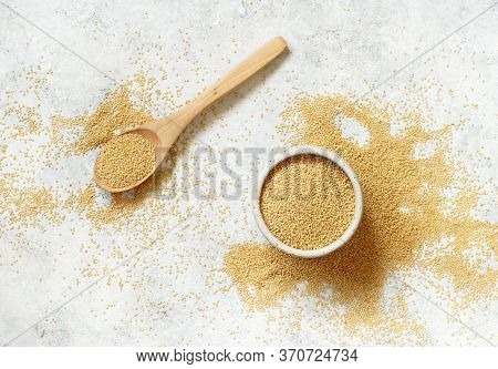 Bowl Of Raw Amaranth Grain With A Spoon Top View On A White Table