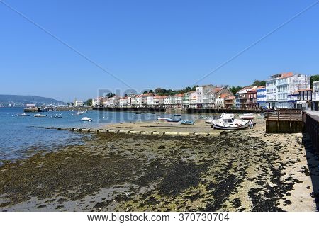 Mugardos, Spain. May 30, 2020. Fishing Village With Wooden Boardwalk, Colorful Houses And Boats With