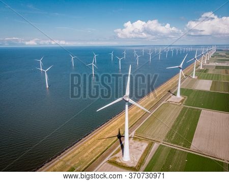 Windmill Park Westermeerdijk Netherlands, Wind Mill Turbine With Blue Sky In Ocean, Green Energy