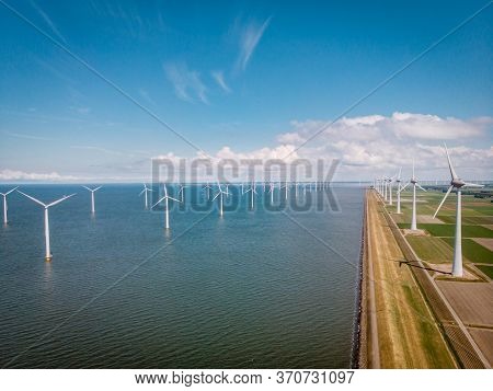 Windmill Park Westermeerdijk Netherlands, Wind Mill Turbine With Blue Sky In Ocean, Green Energy