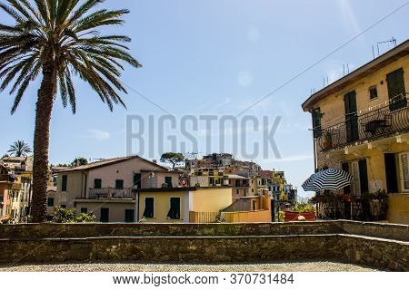 Corniglia, Italy - July 8, 2017: View Of Colorful Houses Of Corniglia On A Sunny Day