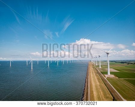 Windmill Park Westermeerdijk Netherlands, Wind Mill Turbine With Blue Sky In Ocean, Green Energy