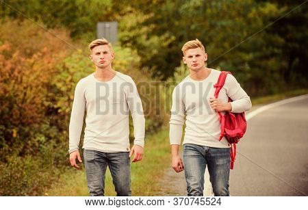 Cheap Travel. Friendship Concept. Men Hitch Hiking. Man Casual Style Travel With Backpack. Traveler 