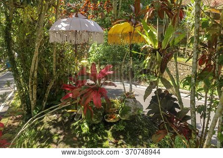 A Sacred Place At The Driveway To Hindu Temple Batukaru On Bali Island In Indonesia. Sacrifices To G