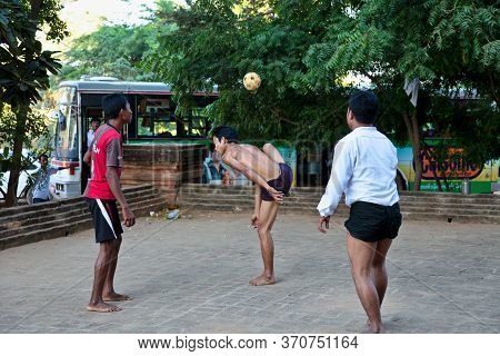 Bagan, Myanmar - Nov 15, 2019: Burmese Men Playing The Traditional Ball Game Of Myanmar: Chinlone.