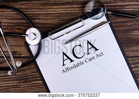 Page With Aca Affordable Care Act On The Table With Stethoscope, Medical Concept