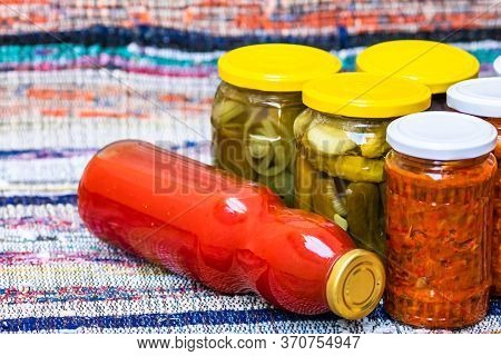 Glass Jars With Pickled Red Bell Peppers And Pickled Cucumbers (pickles) Isolated. Jars With Variety
