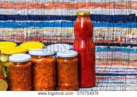 Glass Jars With Pickled Red Bell Peppers And Pickled Cucumbers (pickles) Isolated. Jars With Variety