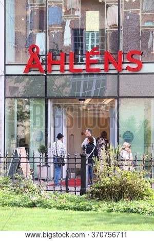 Gothenburg, Sweden - August 26, 2018: People Walk By Ahlens Department Store In Gothenburg, Sweden. 