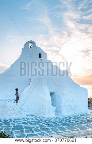 Mykonos Greece, Woman On Vacation At The Greek Island Mykonos, Girl In Dress At The White Streets Of