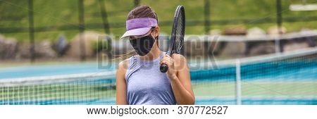 Tennis court reopen after covid-19 confinement. Woman athlete player wearing face mask during game playing oustide on outdoor courts banner panoramic.