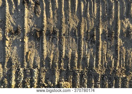 Excavator Tracks On The Ground Texture. Mud Ground Earth Soil Trace Tracks Marks Markings Dry Surfac