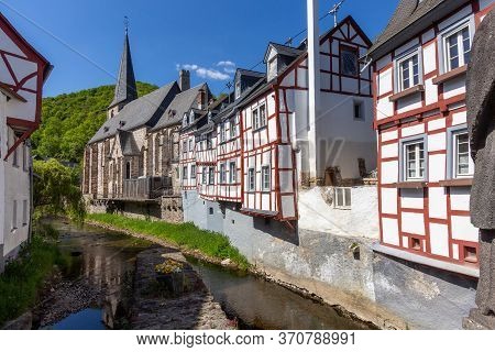 River Elz With Old Bridge And Half-timbered Houses In Monreal, Germany