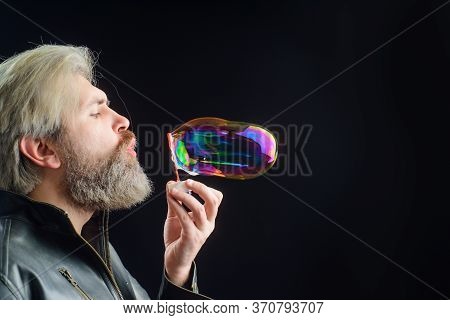 Bearded Man Blowing Bubbles. Soap Bubbles. Play With Bubbles. Bearded Man Blowing Soap Bubbles. Happ