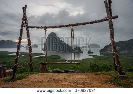 View Of The Wooden Swing With Sametnangshe Island Behind In Phang-nga Province, Thailand.