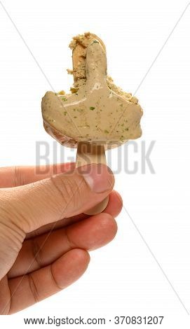 Hand Holding A Seaweed Flavor Popsicle With The Last Bit On White Background