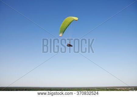 Glider Pilot Flying On Glider. Skydiving Flying. Parachute Extreme Sport