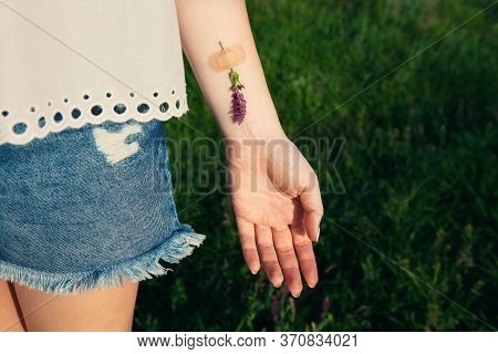 Flower Glued With Band-aid To Hand. Concept Of Mental Health, Medical Care For Different Types Of Me