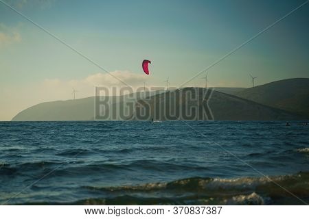 Kitesurfer Riding On The Waves At Prasonisi Kite Beach At Rhodes Island In Summer Day