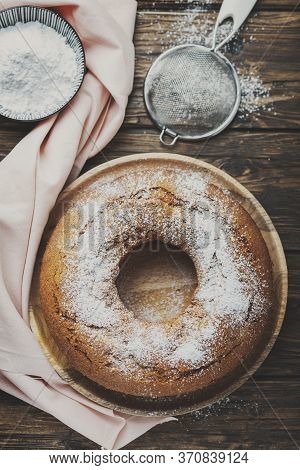 Homemade Bundt Cake On The Wooden Table, Rustic Style And  Toned Image